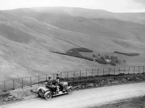 People with a Morris Cowley at the Devil's Beef Tub, Scotland, (c1930s?)
