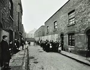 Derelict Gallery: People outside boarded-up houses in Ainstey Street, Bermondsey, London, 1903