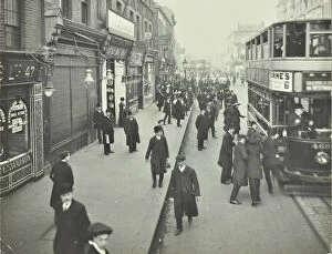 Wandsworth Collection: People rushing to get on a trolley bus at 7.05 am, Tooting Broadway, London, April 1912