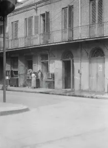 Furniture Shop Prints: People standing by the doorway of a furniture shop in the French Quarter