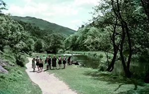 Dove Prints: People walking alongside a river in Dovedale