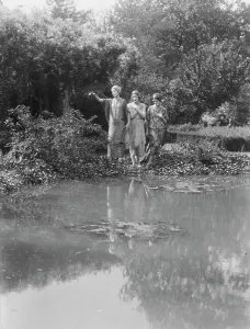 People wearing masks made by W.T. Benda, 1925 Sept. 20. Creator: Arnold Genthe