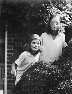 People wearing masks made by W.T. Benda, 1925 Sept. 20. Creator: Arnold Genthe
