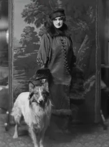 Buttoned Prints: Phillips, Norma, Miss, with dog, portrait photograph, 1914 Nov. 28. Creator: Arnold Genthe