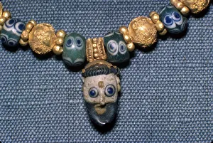 Phoenician Gallery: Phoenician glass head on Etruscan Necklace, c7th century BC