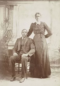 Nmaahc Collection: Photograph of a man sitting down with a woman standing next to him, 1880s - 1900