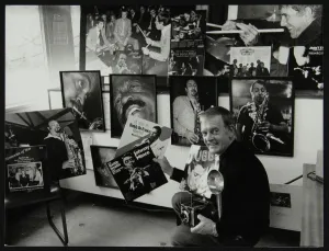 Johnny Gallery: Photographer Denis Williams holding an LP cover