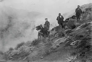 Volcanic Prints: Photographers on hillside photographing Mt