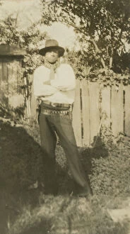 Portraits Gallery: Photographic portrait of a man wearing hat and gun holster, early 20th century