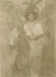 Cowboy Prints: Photographic postcard portrait of Margarette Davenport in costume, early 20th century