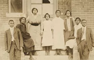 Daughters Collection: Photographic print of 8 people in front of a building, 1904-1918. Creator: Unknown