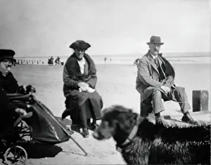 Disability Prints: A physically disabled boy sitting in a wheelchair on a beach, c1910/1925. Creator: Unknown
