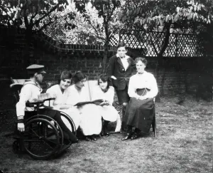Disability Prints: A physically disabled boy sitting in a wheelchair in a garden