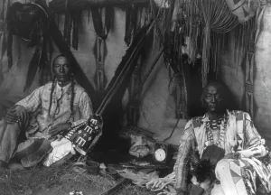 Blackfeet Prints: In a Piegan lodge, c1910. Creator: Edward Sheriff Curtis