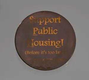 Pinback button promoting public housing in New York City, late 20th century