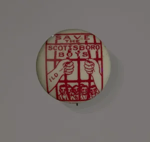 Bars Prints: Pinback button supporting the Scottsboro Boys, 1931. Creator: Eagle Regalia Company