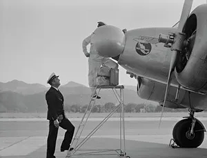 Quarantine Prints: Plant quarantine inspectors examining plane at the Glendale Airport