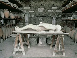 Reproduction Prints: Plaster reproduction of an inhabitant of Pompeii died during the eruption of Vesuvius