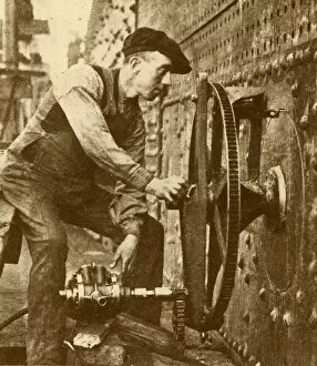 Porthole Collection: A Pneumatic Riveter Cutting Portholes in the Side of a Liner, c1930