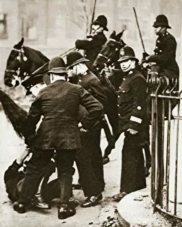 Unemployment Gallery: Police arresting a group of hunger marchers in London, 1932
