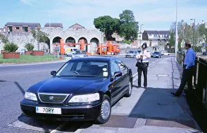 Documents Prints: Policeman checking driver documents