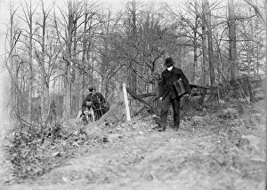 Suitcase Prints: Policeman, police dog, waiting for thief, New York City, 1912. Creator: Bain News Service