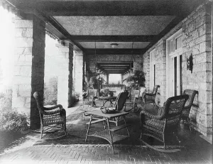 Rocking Chair Prints: Porch of E.C. Converse house, with wicker furniture