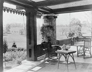Rocking Chair Prints: Porch with wicker furniture, and view over lawn to home of Edmund