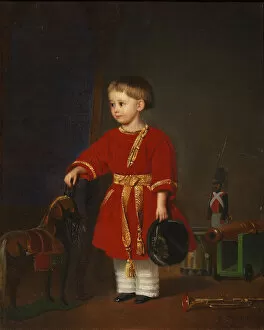 Portrait of a boy in a red dress with military toys
