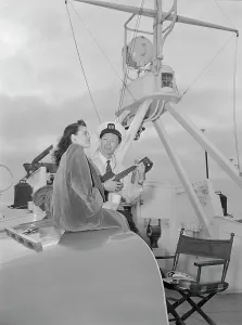 Portrait of Frank Raye and Betty Brewer, Ukelele Lady (yacht), Hudson River, N.Y. ca. June 1947. Creator: William Paul Gottlieb