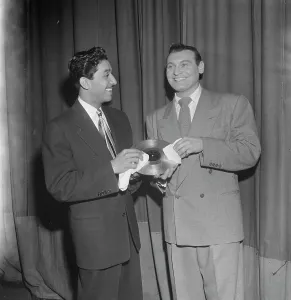 Polishing Prints: Portrait of Frankie Laine, New York, N.Y. 1946. Creator: William Paul Gottlieb