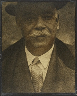 Hand Colored Gelatin Silver Print Prints: Portrait of a Man with Hat Brim, 1907-1943. Creator: Louis Fleckenstein