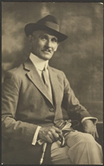 Portrait of a Man Holding Cane and Gloves, 1907-1943. Creator: Louis Fleckenstein