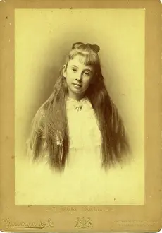 Embossed Prints: Portrait photography of an unknown teenage girl with beautiful long hair. Creator: Unknown