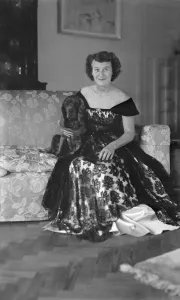 Seat Prints: Portrait of seated woman in evening dress with her dog