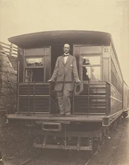 Railway Carriage Prints: Portrait of an unidentified man standing on rear platform of a train
