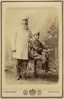 Overcoat Collection: Portrait of an unknown man with a boy sitting on a bicycle, end of 19th century