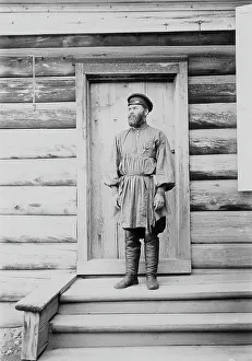 Log Building Prints: Portrait of an unknown man on the porch of a wooden house