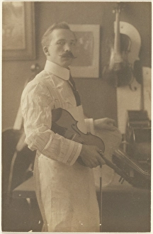 Craftsman Prints: Portrait of a Violin Maker in Studio, 1895-1943. Creator: Louis Fleckenstein