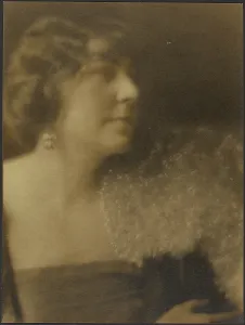 Looking Sideways Prints: Portrait of a Woman with Flowers, 1907-1943. Creator: Louis Fleckenstein