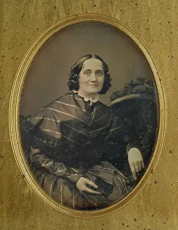Daguerreotype Prints: Portrait of a woman holding a book, about 1850. Creator: Southworth and Hawes