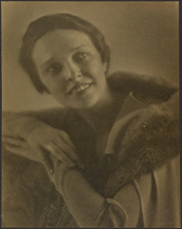 Portrait of a Woman Leaning on Chair, 1907-1943. Creator: Louis Fleckenstein