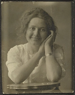 Portrait of a Woman Leaning on Table, 1907-1943. Creator: Louis Fleckenstein
