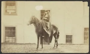 Riding Habit Prints: Portrait of a Woman Riding a Horse, late 19th century. Creator: Unknown
