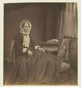 Portrait of a woman, wearing a bonnet, seated, 1850s. Creator: Roger Fenton