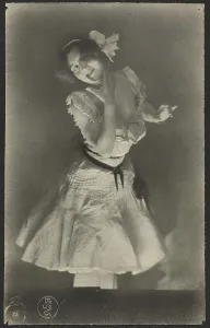 Portrait of woman in white dress, 1900-1915. Creator: Constant Puyo