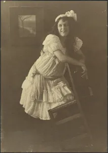 Portrait of a Young Woman with Chair, 1907-1943. Creator: Louis Fleckenstein
