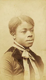 Portrait of young woman with velvet lapels and ribbon bow around neck, (1880-1889?). Creator: LV Bean