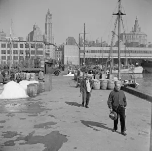 Possibly: Barrels of fish on the docks at Fulton fish market ready to be shipped... New York, 1943. Creator: Gordon Parks