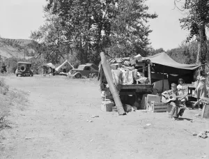 Possibly: Camp of migratory families in Ramblers Park, Yakima Valley, Washington, 1939. Creator: Dorothea Lange